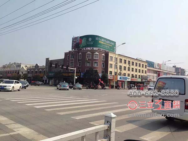河北省邯鄲市叢臺區(qū)樓頂三面翻圓弧形廣告牌案例施工圖片