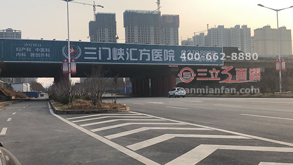 河南省三門峽市跨路橋體三面翻平直廣告牌案例施工圖片